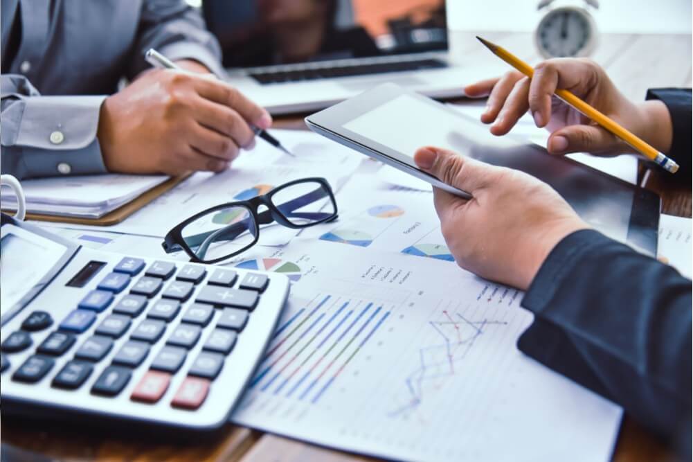 Team reviewing data charts and graphs for business strategy