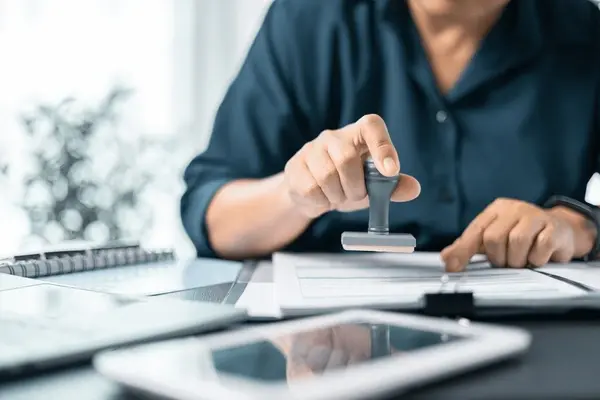 Banking officer stamped the document to approve the loan