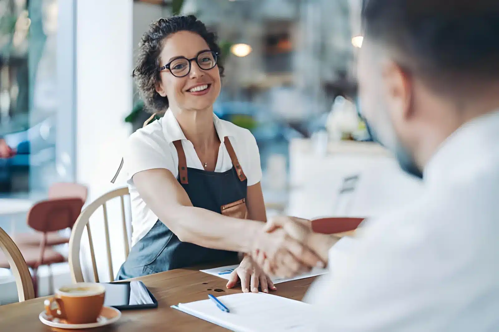 Smiling mid-aged woman, small business owner